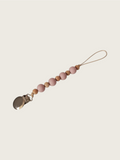 Pacifier clip with dusty pink and brown wooden beads on a beige background | Pip & Jam