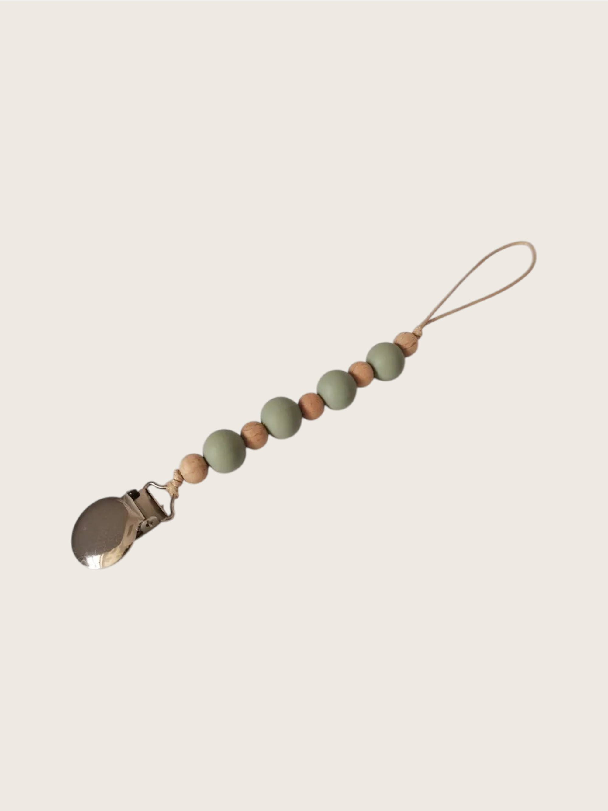 Pacifier clip with olive green and brown wooden beads on a beige background | Pip & Jam