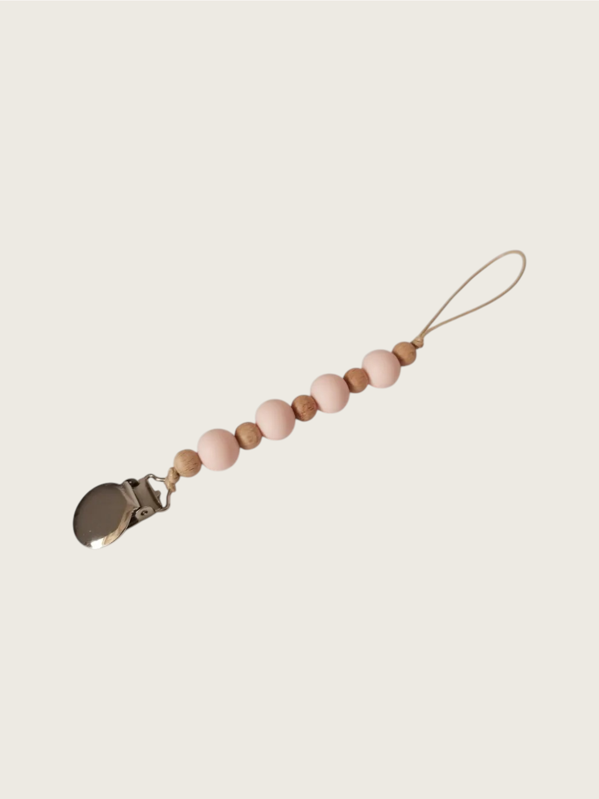Pacifier clip with pastel pink and brown wooden beads on a beige background | Pip & Jam